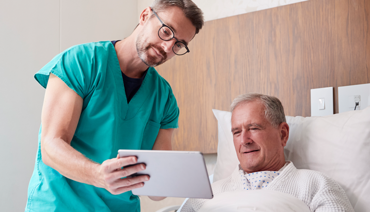 Doctor showing patient consent form on a tablet